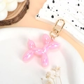 Pink balloon dog keychain with iridescent finish and gold metal lobster clasp for bags - Iridescent Light Pink