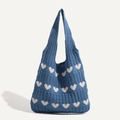 Knitted navy blue shoulder bag with white heart patterns and soft woven texture - Blue