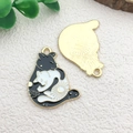 Enamel black and white moon cat charms with sun patterns in a golden metal finish - Two Hugging Cats (24.5x29mm)