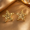 Vintage gold starfish stud earrings with embossed hearts on textured metallic finish - Starfish Earrings / Gold