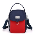 Bolso bandolera de nailon en azul marino y rojo con múltiples compartimentos - Retazos Rojo y Azul