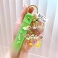 Grüner Acrylbär Schlüsselanhänger mit flüssigem Glitzer und Regenbogenband - Grüner Öl-Bär