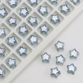 Macro view of transparent gray star glass beads for DIY jewelry and hair accessories - Light Blue Grey