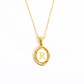 Gold-plated oval pendant necklace featuring a white letter R on a stainless steel chain - Letter R - Gold