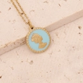 Macro shot of gold circular pendant with blue enamel and relief silhouette detail - Blue Enamel Relief Portrait Style (7#)