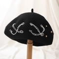 Black wool beret featuring a stylish silver metal chain and subtle stud accents - One Size / Black