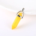 Natural yellow quartz hexagonal point pendant with silver metal clasp on white background - Yellow Stone
