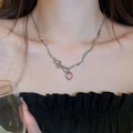 Detail showing wavy metal chain with pink heart pendant and colorful stones on neck - Multi-color Heart Wave Chain