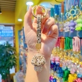 Golden mushroom keychain with brown rhinestones and sparkling crystal strap on hand - Full Drill Mushroom-Grey