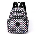 Women's lightweight nylon backpack featuring a white and black grid with pink accents - Three-color Block