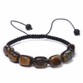 Macro shot of hand-woven tiger eye stones with adjustable black wax cord bracelet - Tiger Eye Bracelet