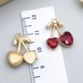 Golden cherry pendants with red crystal heart rhinestones and ruler for size scale - Red Stone Heart Cherry Small Left Large Right (23415)