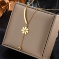 Golden titanium steel daisy necklace with tassel pendants in a beige jewelry box - Flower Bar Bead Necklace (N1234)