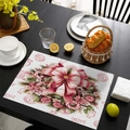 Pink Christmas placemat with bow and candy patterns on a black wooden table - 30x45cm Waterproof Linen / CD57-1