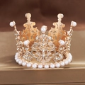 Close-up of golden alloy crown with white pearls and rhinestones on a metal stand - Small Round Rose Gold 01