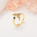 Detail of whale tail ring with colorful crystals and a deep blue gemstone accent - Multicolor Zircon Fish Tail