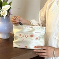 Green satin makeup bag with rabbit and mushroom print in hand with brush - Mushroom Rabbit Light Green
