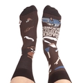 Detailed view of asymmetrical crew socks with car and tool patterns on brown cotton fabric - One Size / American Life