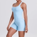 Detail view of light blue yoga set featuring high waist shorts with functional side pockets - S / Top And Bottom / Sky Blue