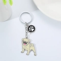 Cute yellow pug metal keychain with a black and white paw print charm on white background - Pug (M10209)