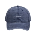 Detailed view of white cursive 'mama' embroidery on washed navy blue cotton cap - Navy Blue