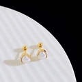 Detailed close-up of gold heart-shaped stud earrings with iridescent pearl inlay on a white tray - Heart Artificial Pearl