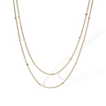 Collana a doppio strato in maglia serpente dorata con ciondoli a disco su sfondo bianco - Catena a Serpente a Doppio Strato / Oro