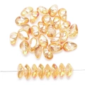 Macro detail of teardrop glass beads in iridescent orange with smooth straight hole - Gold Rose Red