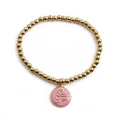 Pulsera elástica de cuentas doradas con colgante de chapa rosa y grabado Be Free - Rosa