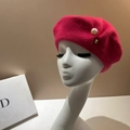 Detail view of a magenta wool beret featuring pearl and gold bead accents on a mannequin - M (56-58cm) / Rose Red