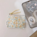 Detailed close-up of floral cotton pouch with yellow cord puller and simple wish label - Cream Light Yellow Floral