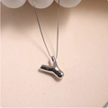 Macro detail of a 3D silver balloon letter Y pendant with mirror-polished surface - Silver (With Necklace) Y