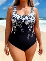 Detailed view of black and white floral print swimsuit on beach background - Antique Silver