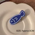 Cute Y2K blue fish acrylic hair clip 5cm size shown on a beige ceramic plate - 5# Small Fish Hair Clip