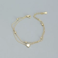 Double-layered gold S925 silver bracelet featuring polished beads and a heart pendant - 925 Silver / Gold
