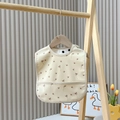 Waterproof baby bib in light yellow with dandelion print and catch-all food pocket - Bee And Flower