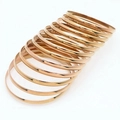 Set of 13 minimalist rose gold thin stainless steel bangles with polished finish - Inner Diameter 55mm / Rose Gold (12 Rings)