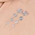 Elegant silver long drop earrings with cascading spiral textured metal disks on satin - Silver Quadruple Graduated Rippled Discs