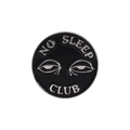 Round black enamel pin featuring NO SLEEP CLUB text and silver eye design accessory - No Sleep Club