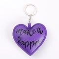 Close-up of purple PU leather heart keychain with Make It Happen text and silver ring - Purple Heart