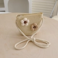 Detail of child's straw crossbody bag featuring crochet flowers and a silver zipper - Bag-Beige