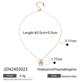 Gold plated stainless steel necklace featuring a bow pendant with white zircon crystals - Golden Bow Tie Style (JDN2403023)