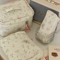 Three-piece quilted floral makeup bag set in white with pink bows and handles - Lily of the Valley