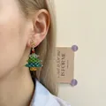 Close-up of handmade beaded Christmas tree earrings with colorful crystal accents - Christmas Tree Snowflake-Silver Pin / Stud Earrings