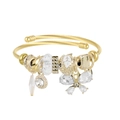 Detailed macro of gold spiral bangle featuring crystal butterfly and pave bead charms - Gold Plated White Butterfly