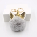 Porte-clés licorne en peluche grise avec corne dorée et fermoir métallique - Gris clair