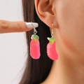 Pink citrus fruit drop earrings with green leaf and silver hooks on female model - White Gold Pink Fruit Slice