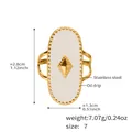 Detail view of gold stainless steel oval ring with white enamel and diamond accent - US 7 / White