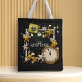 Detail of black canvas tote with Happy New Year clock print and gold star pattern - Style 56