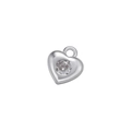 Macro detail of a silver heart pendant with a sparkling micro-set round zircon stone - White Gold Heart
